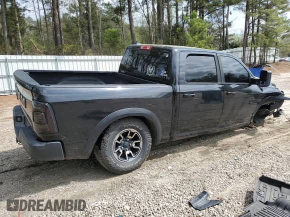 2015 Ram 1500 Rebel with VIN 1C6RR7YT3FS780133, listed as a Copart auction lot 51484275 with 127,543 mi miles and Salvage title. Bid and sale history available at DreamBid. Image 3.