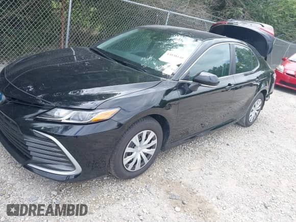 2022 Toyota Camry Hybrid LE with VIN 4T1C31AK3NU574937, listed as a IAAI auction lot 43038140 with 50,708 mi miles and . Bid and sale history available at DreamBid. Image 2.