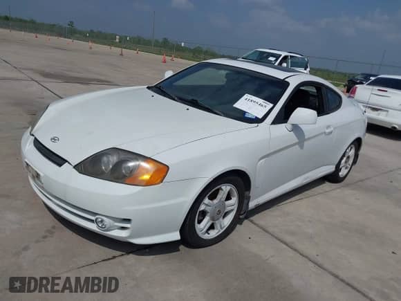 2003 Hyundai Tiburon GT с VIN KMHHN65FX3U036095, выставлен на аукционе IAAI как лот 41895465 с пробегом 179 838 миль миль и . История ставок и продаж доступна на DreamBid. Изображение 2.