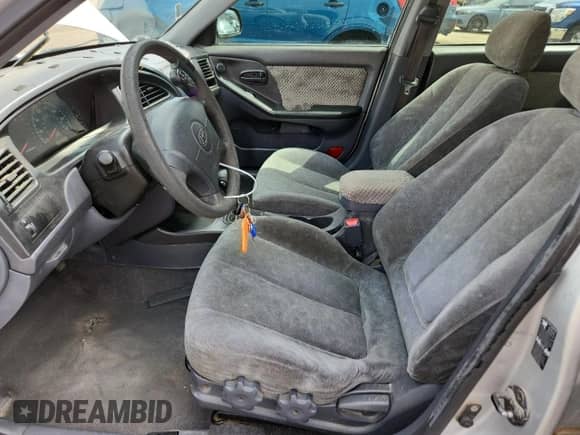 2003 Hyundai Elantra GLS с VIN KMHDN45D63U477319, выставлен на аукционе Copart как лот 71178145 с пробегом Не указан миль и Списание • Salvage title. История ставок и продаж доступна на DreamBid. Изображение 7.