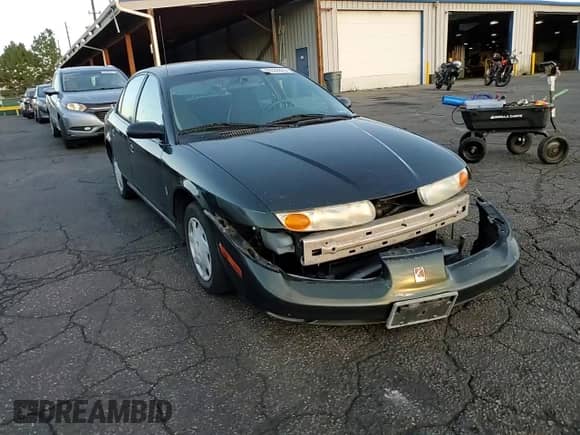 2002 Saturn SL with VIN 1G8ZG52842Z136529, listed as a Copart auction lot 69322825 with 215,279 mi miles and Salvage title. Bid and sale history available at DreamBid. Image 13.