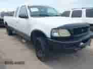 1997 Ford F-150 XL with VIN 1FTEX18LXVKB59576, listed as a IAAI auction lot 43095414 with 117,419 mi miles and . Bid and sale history available at DreamBid. Image 1.