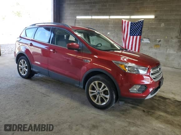 2018 Ford Escape SE с VIN 1FMCU9GDXJUD35058, выставлен на аукционе Copart как лот 82302705 с пробегом 62 136 миль миль и Списание • Salvage title. История ставок и продаж доступна на DreamBid. Изображение 4.