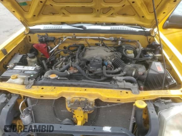 2002 Nissan Frontier XE with VIN 1N6ED26T22C385339, listed as a Copart auction lot 70018515 with 213,434 mi miles and Clean title. Bid and sale history available at DreamBid. Image 11.