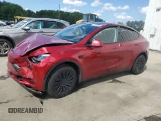 2024 Tesla Model Y Long Range with VIN 7SAYGDEE9RF161880, listed as a Copart auction lot 67988665 with 26,888 mi miles and Salvage title. Bid and sale history available at DreamBid. Image 1.
