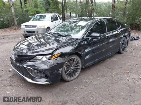 2021 Toyota Camry XSE with VIN 4T1K61AK3MU527991, listed as a IAAI auction lot 43170705 with 117,528 mi miles and . Bid and sale history available at DreamBid. Image 2.