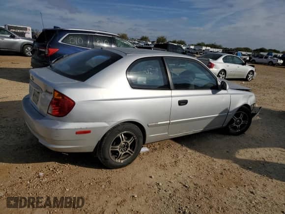 2004 Hyundai Accent GL с VIN KMHCG35C94U292013, выставлен на аукционе Copart как лот 84253364 с пробегом Не указан миль и Списание • Salvage title. История ставок и продаж доступна на DreamBid. Изображение 3.