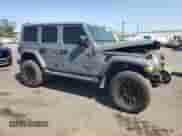 2021 Jeep Wrangler Unlimited Sahara with VIN 1C4HJXEG8MW866532, listed as a Copart auction lot 63156915 with 28,239 mi miles and Salvage title. Bid and sale history available at DreamBid. Image 4.