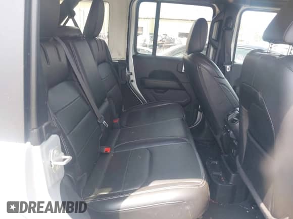 2023 Jeep Wrangler Sahara with VIN 1C4JJXP69PW695915, listed as a IAAI auction lot 42662028 with 36,957 mi miles and . Bid and sale history available at DreamBid. Image 8.