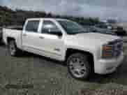 2014 Chevrolet Silverado 1500 High Country with VIN 3GCUKTEJ0EG431584, listed as a Copart auction lot 49073475 with 212,354 mi miles and Salvage title. Bid and sale history available at DreamBid. Image 4.