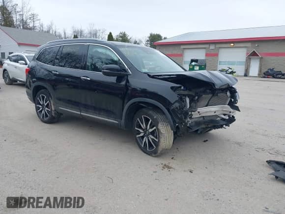 2020 Honda Pilot Elite z VIN 5FNYF6H0XLB003034, wystawiony jako IAAI lot #41945519 z przebiegiem 47 605 mil mil oraz . Historia ofert i sprzedaży dostępna na DreamBid. Obrazek 1.