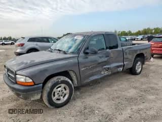 2001 Dodge Dakota z VIN 1B7GL22X91S341785, wystawiony jako Copart lot #90262095 z przebiegiem 164 468 mil mil oraz Szkoda całkowita • Salvage title. Historia ofert i sprzedaży dostępna na DreamBid. Obrazek 1.