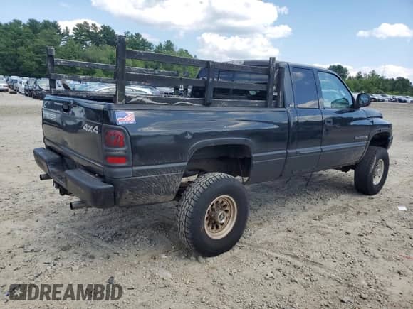 2002 Dodge 2500 with VIN 3B7KF23Z32M295804, listed as a Copart auction lot 65463145 with 319,735 mi miles and Clean title. Bid and sale history available at DreamBid. Image 3.