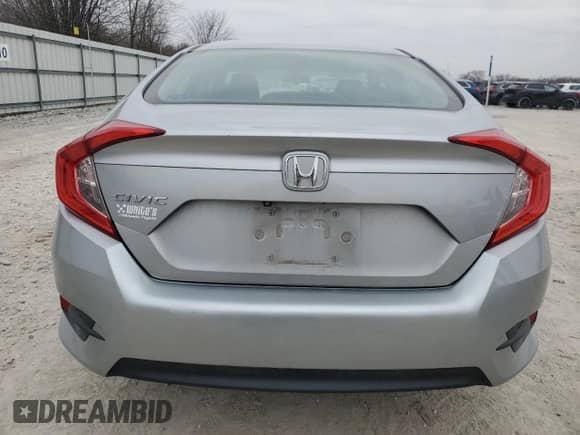 2016 Honda Civic LX с VIN 19XFC2F59GE052681, выставлен на аукционе Copart как лот 42704325 с пробегом 143 184 миль миль и Списание • Salvage title. История ставок и продаж доступна на DreamBid. Изображение 6.