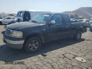 2002 Ford F-150 XL with VIN 1FTRX17L12NB93130, listed as a Copart auction lot 67864405 with 133,612 mi miles and Salvage title. Bid and sale history available at DreamBid. Image 1.