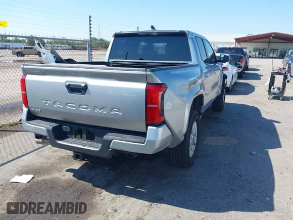 2024 Toyota Tacoma TRD Off Road with VIN 3TMLB5JN8RM010395, listed as a IAAI auction lot 43375716 with 20,319 mi miles and . Bid and sale history available at DreamBid. Image 4.