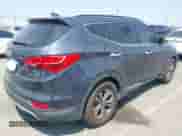 2014 Hyundai Santa Fe with VIN 5XYZU3LB3EG129409, listed as a IAAI auction lot 42987145 with 95,448 mi miles and . Bid and sale history available at DreamBid. Image 4.