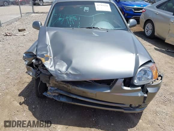 2005 Hyundai Accent GLS z VIN KMHCG45C55U608336, wystawiony jako IAAI lot #42743218 z przebiegiem 221 254 mil mil oraz . Historia ofert i sprzedaży dostępna na DreamBid. Obrazek 12.