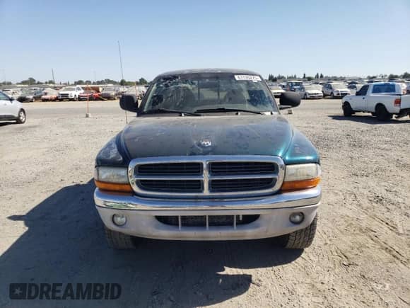 1999 Dodge Dakota SLT z VIN 1B7GG22Y0XS235487, wystawiony jako Copart lot #67135275 z przebiegiem 142 222 mil mil oraz Czysty tytuł • Clean title. Historia ofert i sprzedaży dostępna na DreamBid. Obrazek 5.