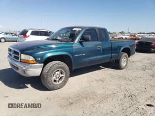 1999 Dodge Dakota SLT с VIN 1B7GG22Y0XS235487, выставлен на аукционе Copart как лот 67135275 с пробегом 142 222 миль миль и Чистый • Clean title. История ставок и продаж доступна на DreamBid. Изображение 1.
