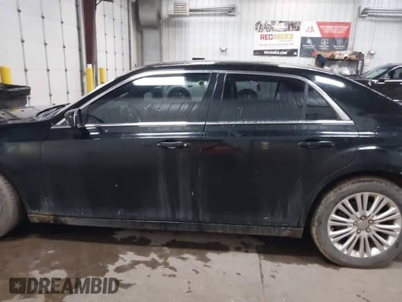 2013 Chrysler 300 with VIN 2C3CCARG0DH736159, listed as a IAAI auction lot 41941042 with 137,661 mi miles and . Bid and sale history available at DreamBid. Image 14.
