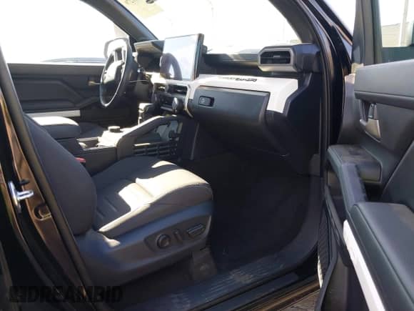 2024 Toyota Tacoma SR5 with VIN 3TMKB5FN3RM000779, listed as a IAAI auction lot 43081279 with 24,906 mi miles and . Bid and sale history available at DreamBid. Image 5.