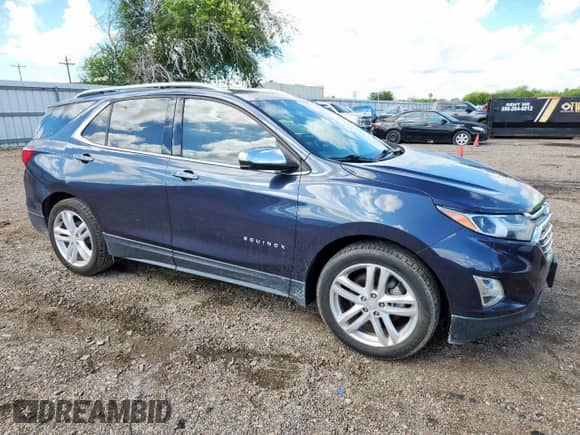 2018 Chevrolet Equinox Premier with VIN 3GNAXNEX1JS633613, listed as a Copart auction lot 80985185 with 87,243 mi miles and Salvage title. Bid and sale history available at DreamBid. Image 4.