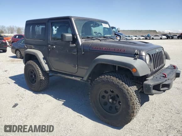 2014 Jeep Wrangler Rubicon with VIN 1C4BJWCG7EL256627, listed as a Copart auction lot 49608025 with 149,428 mi miles and Salvage title. Bid and sale history available at DreamBid. Image 4.