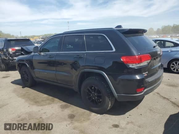 2018 Jeep Grand Cherokee Laredo with VIN 1C4RJFAG8JC390347, listed as a Copart auction lot 55224235 with 80,390 mi miles and Salvage title. Bid and sale history available at DreamBid. Image 2.