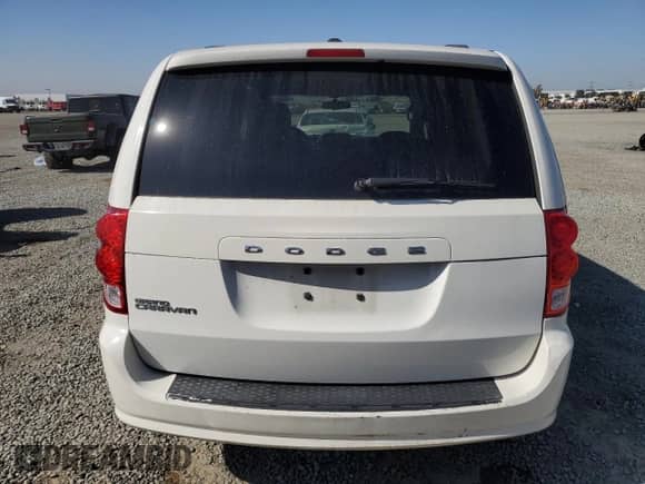 2013 Dodge Grand Caravan SXT with VIN 2C4RDGCG9DR618622, listed as a Copart auction lot 90457375 with 181,498 mi miles and Salvage title. Bid and sale history available at DreamBid. Image 6.