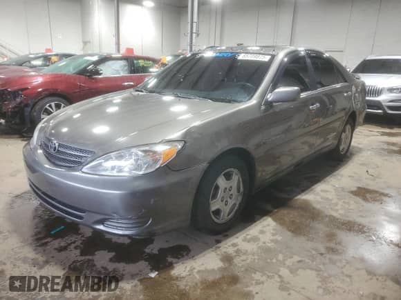 2003 Toyota Camry LE с VIN 4T1BF32K33U548784, выставлен на аукционе Copart как лот 85709875 с пробегом 175 340 миль миль и Списание • Salvage title. История ставок и продаж доступна на DreamBid. Изображение 1.