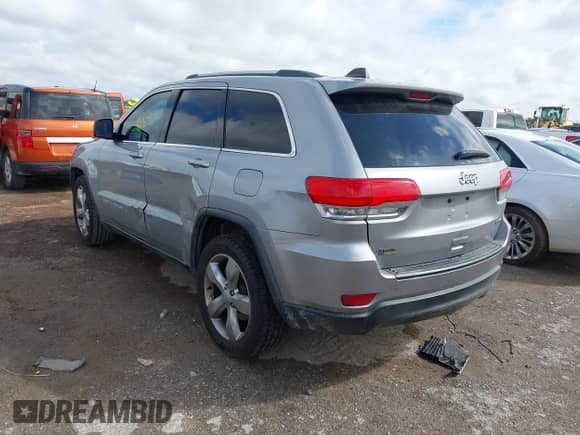 2014 Jeep Grand Cherokee Laredo with VIN 1C4RJEAG0EC151049, listed as a IAAI auction lot 43293620 with 199,259 mi miles and . Bid and sale history available at DreamBid. Image 3.