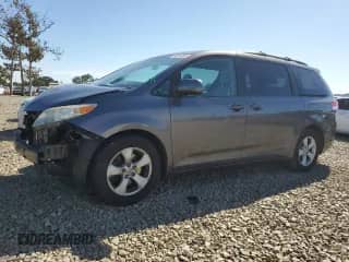 2011 Toyota Sienna LE AAS with VIN 5TDKK3DC1BS173695, listed as a Copart auction lot 82241805 with 129,894 mi miles and Salvage title. Bid and sale history available at DreamBid. Image 1.