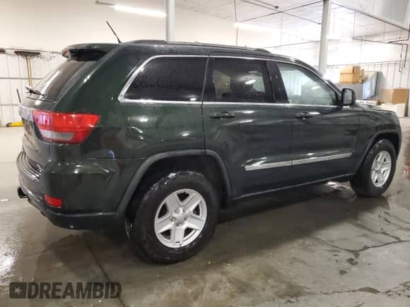 2011 Jeep Grand Cherokee 70th Anniversary z VIN 1J4RR4GT3BC736981, wystawiony jako Copart lot #49171525 z przebiegiem 127 438 mil mil oraz Szkoda całkowita • Salvage title. Historia ofert i sprzedaży dostępna na DreamBid. Obrazek 3.