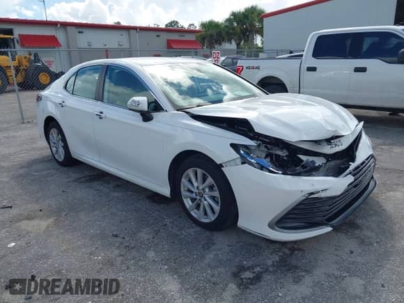 2021 Toyota Camry LE with VIN 4T1C11AK8MU601313, listed as a IAAI auction lot 43383218 with 34,384 mi miles and . Bid and sale history available at DreamBid. Image 1.