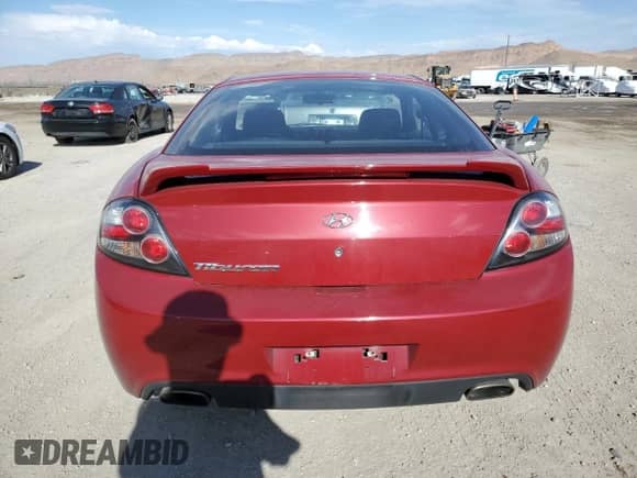 2007 Hyundai Tiburon GS с VIN KMHHM66D97U252509, выставлен на аукционе Copart как лот 69622644 с пробегом 105 908 миль миль и Чистый • Clean title. История ставок и продаж доступна на DreamBid. Изображение 6.