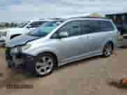 2014 Toyota Sienna SE with VIN 5TDXK3DC0ES412437, listed as a Copart auction lot 70558525 with 145,488 mi miles and Salvage title. Bid and sale history available at DreamBid. Image 1.