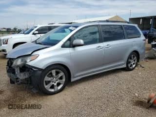2014 Toyota Sienna SE with VIN 5TDXK3DC0ES412437, listed as a Copart auction lot 70558525 with 145,488 mi miles and Salvage title. Bid and sale history available at DreamBid. Image 1.