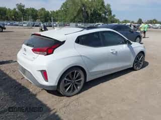 2020 Hyundai Veloster 2.0 z VIN KMHTG6AF3LU025823, wystawiony jako IAAI lot #43136506 z przebiegiem 43 611 mil mil oraz . Historia ofert i sprzedaży dostępna na DreamBid. Obrazek 4.