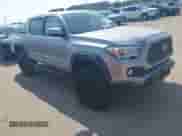 2021 Toyota Tacoma SR with VIN 5TFCZ5ANXMX268304, listed as a IAAI auction lot 43066752 with 66,578 mi miles and . Bid and sale history available at DreamBid. Image 1.