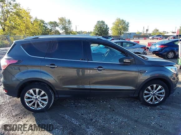 2017 Ford Escape Titanium with VIN 1FMCU9J94HUB03828, listed as a IAAI auction lot 43336898 with 164,743 mi miles and . Bid and sale history available at DreamBid. Image 13.