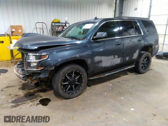 2019 Chevrolet Tahoe LS with VIN 1GNSKAEC6KR121486, listed as a IAAI auction lot 41064193 with 118,108 mi miles and . Bid and sale history available at DreamBid. Image 2.
