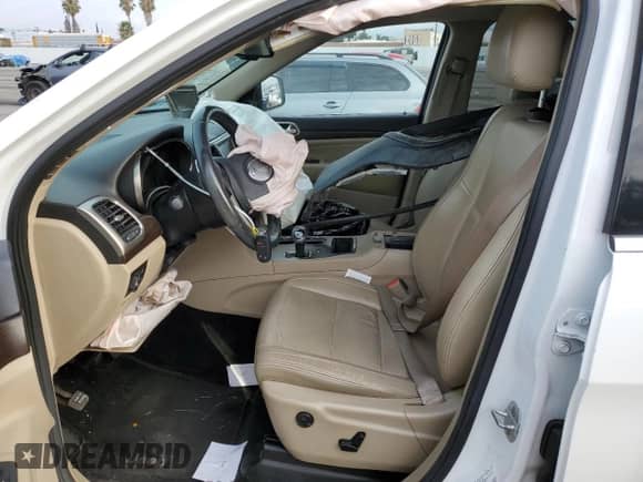 2014 Jeep Grand Cherokee Laredo with VIN 1C4RJEAG4EC265653, listed as a Copart auction lot 84594325 with Not provided miles and Salvage title. Bid and sale history available at DreamBid. Image 7.