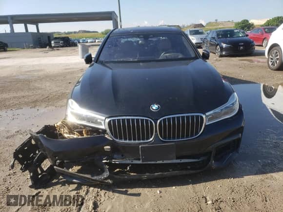 2018 BMW 7 Series 750i with VIN WBA7F0C58JGM23726, listed as a Copart auction lot 69116685 with 32,765 mi miles and Salvage title. Bid and sale history available at DreamBid. Image 5.