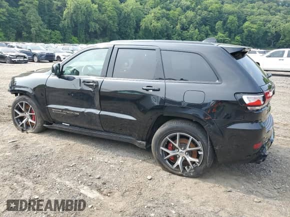 2021 Jeep Grand Cherokee Trackhawk z VIN 1C4RJFN94MC605884, wystawiony jako Copart lot #80843725 z przebiegiem 7 652 mil mil oraz Szkoda całkowita • Salvage title. Historia ofert i sprzedaży dostępna na DreamBid. Obrazek 2.