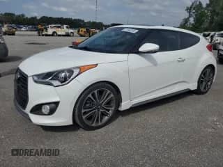2016 Hyundai Veloster Turbo с VIN KMHTC6AE7GU292343, выставлен на аукционе Copart как лот 81943395 с пробегом 71 718 миль миль и Списание • Salvage title. История ставок и продаж доступна на DreamBid. Изображение 1.
