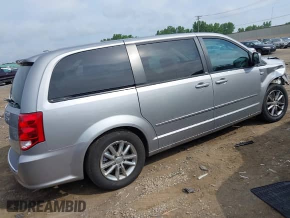 2014 Dodge Grand Caravan American Value with VIN 2C4RDGBG8ER190724, listed as a IAAI auction lot 42718765 with 75,976 mi miles and . Bid and sale history available at DreamBid. Image 4.