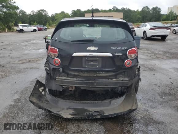 2012 Chevrolet Sonic LTZ with VIN 1G1JE6SH1C4132511, listed as a Copart auction lot 58445765 with 82,611 mi miles and Salvage title. Bid and sale history available at DreamBid. Image 6.