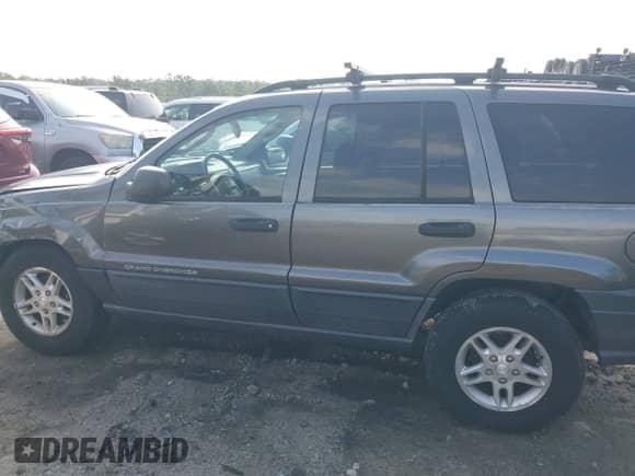 2003 Jeep Grand Cherokee Laredo z VIN 1J4GX48S63C578270, wystawiony jako IAAI lot #42656724 z przebiegiem 216 000 mil mil oraz . Historia ofert i sprzedaży dostępna na DreamBid. Obrazek 14.