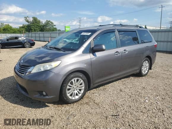 2016 Toyota Sienna XLE with VIN 5TDYK3DC3GS696878, listed as a Copart auction lot 69670585 with 148,930 mi miles and Salvage title. Bid and sale history available at DreamBid. Image 1.